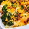 Delicious Broccoli Bacon Cheddar Chicken dish served with veggies and melted cheese