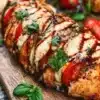 Caprese Stuffed Chicken with mozzarella, tomatoes and basil on a plate