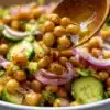 Chickpea cucumber salad served in a bowl with fresh vegetables