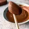 A decadent Chocolate Cremeux dessert served in a stylish dish.