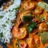 Delicious Coconut Shrimp Curry served in a bowl with herbs and spices