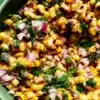 Bowl of fresh corn salsa made with vibrant ingredients.
