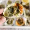 Delicious Garlic Butter Oysters garnished with herbs and served on a plate