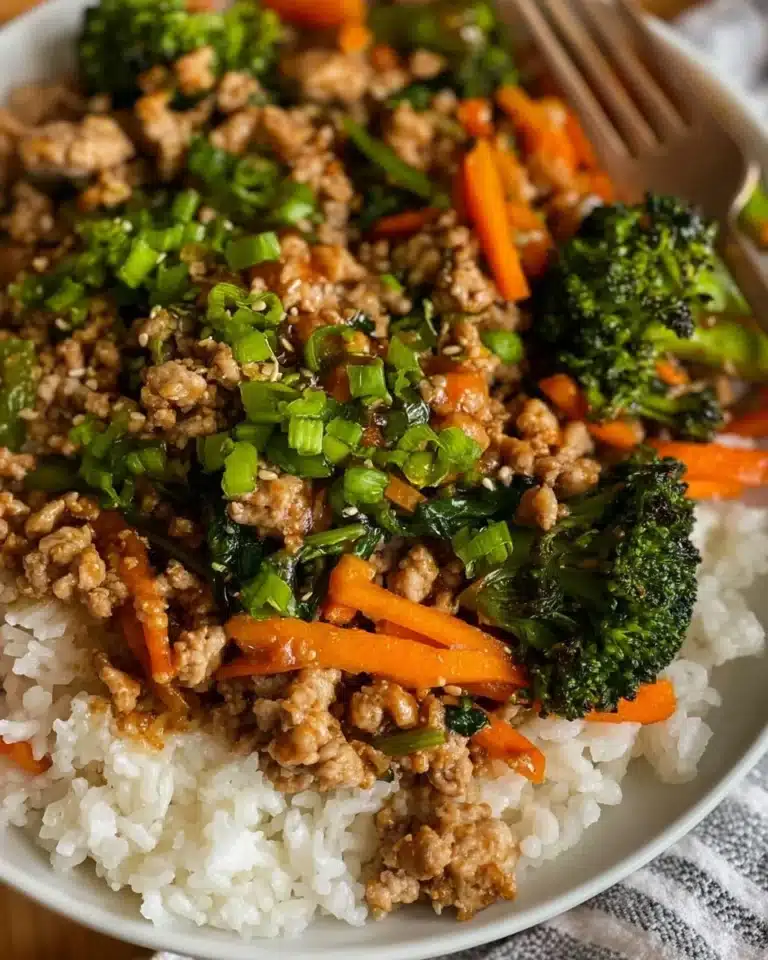 Ground turkey teriyaki stir fry served in a colorful bowl with vegetables.