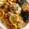 A delicious plate of Lemon Garlic Chicken garnished with fresh herbs.
