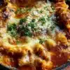 One pot skillet lasagna cooked in a skillet, showcasing layers of pasta, cheese, and sauce.