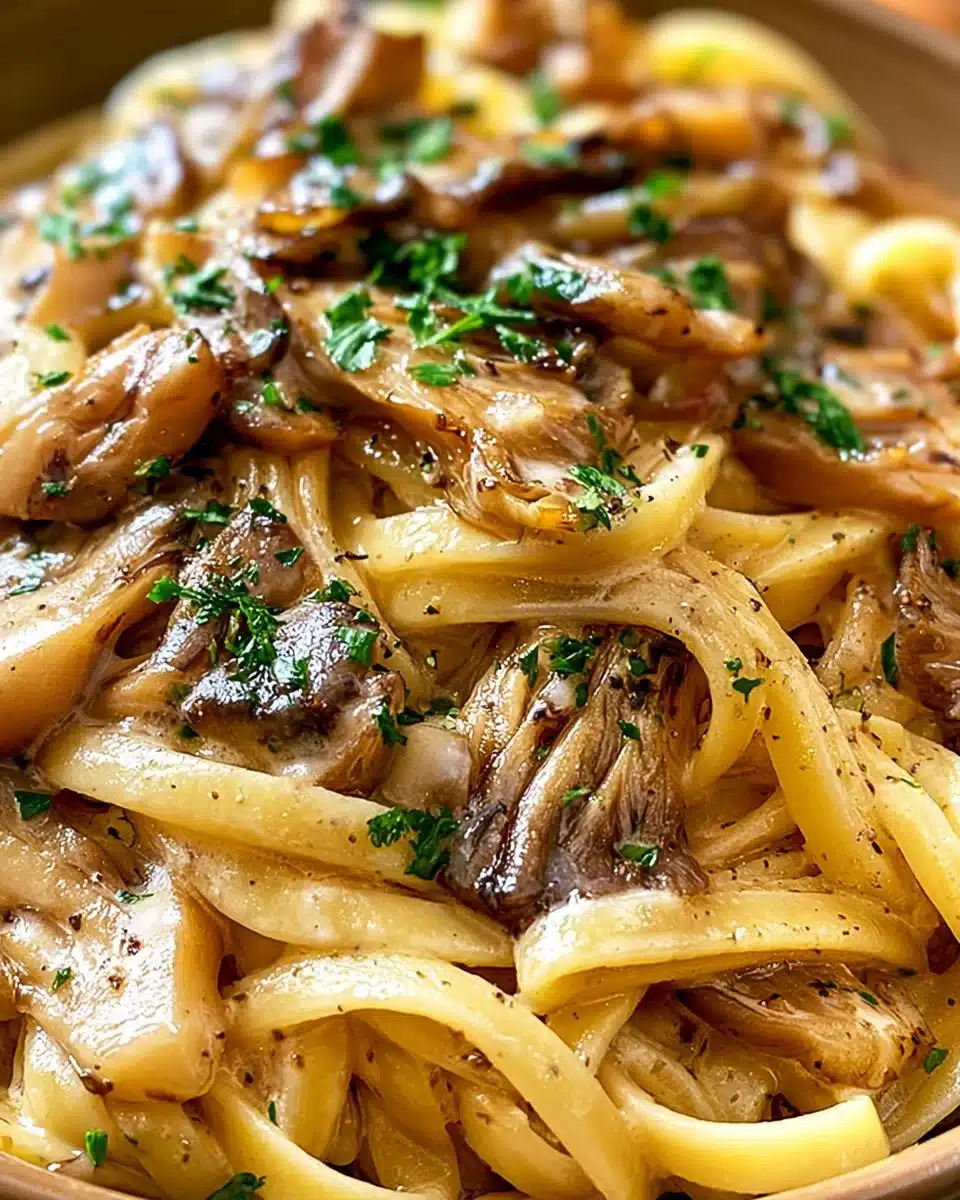 Delicious plate of creamy Oyster Mushroom Pasta garnished with herbs