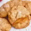 Freshly baked peach cookies with a golden crust and sweet peach chunks