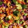 Colorful rice salad with vegetables and herbs served in a bowl