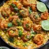 Delicious street corn topped with cheese and spices on a wooden table