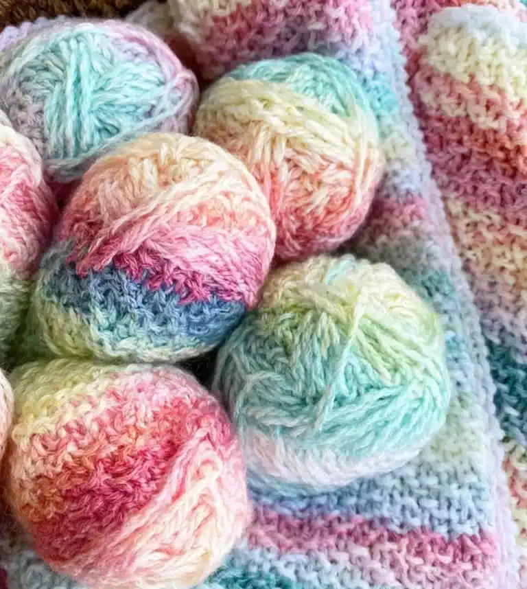 Cozy Alpine Stitch Blanket showcasing intricate knitting patterns and textures.