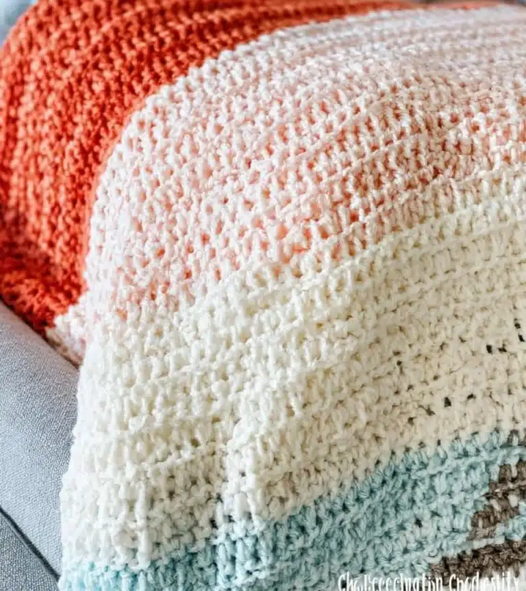 Cozy and colorful crochet blanket displayed on a comfortable sofa