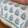 Cozy sailboat blanket for nautical-themed decor and warmth
