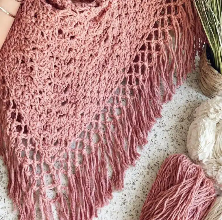 Handcrafted Shell Stitch Poncho in vibrant colors for stylish warmth.