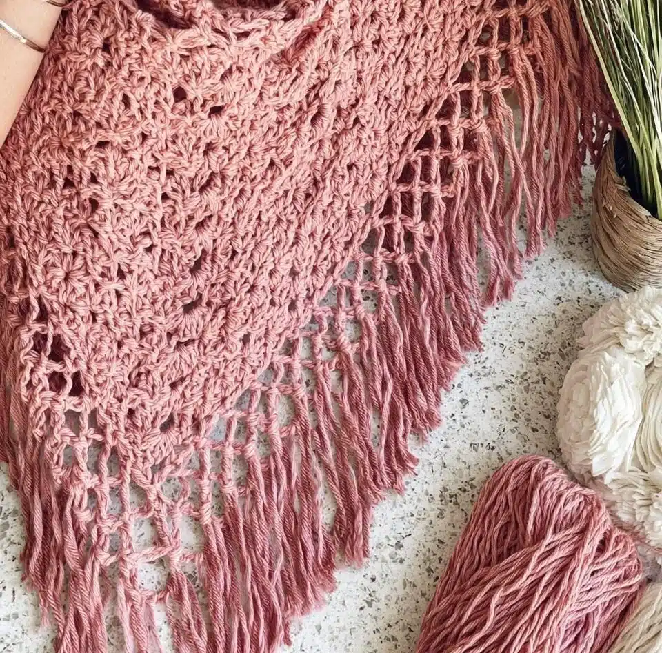 Handcrafted Shell Stitch Poncho in vibrant colors for stylish warmth.